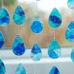 Blue Crayon Raindrop Suncatchers: A Dreamy Craft for Rainy Days & Sunny Windows - Savory Splash
